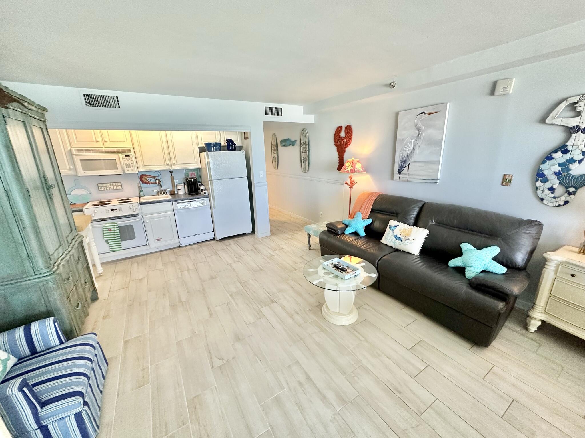 4280 Beachside 2, Unit 280 Miramar Beach, FL 32550 - Photo 8 of 34 a living room with furniture and wooden floor