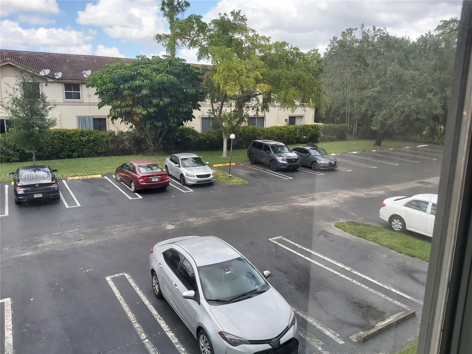 2501 Riverside Drive, Unit 212A Coral Springs, FL 33065 - Photo 5 of 7 a view of a street with cars