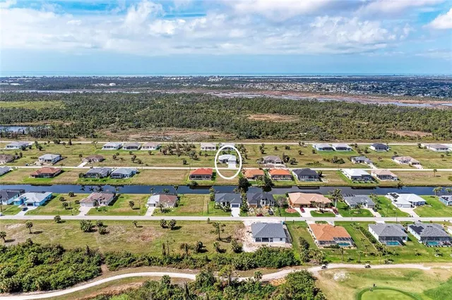 a view of a ocean with a building in the background