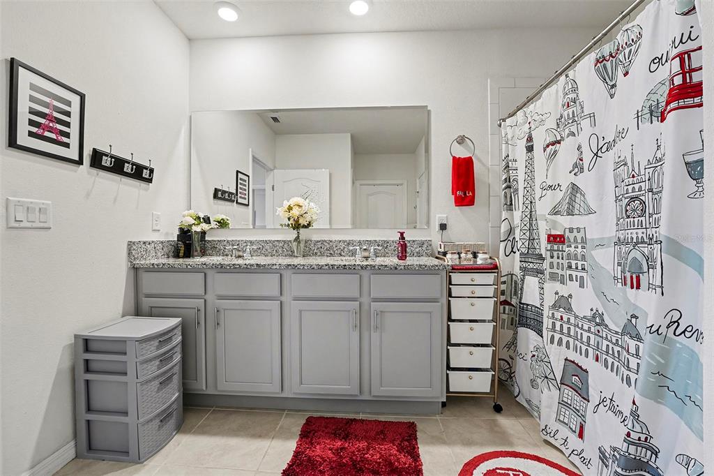 2756 Grandbury Grove Road Lakeland, FL 33811 - Photo 14 of 27 a bathroom with a sink vanity and mirror
