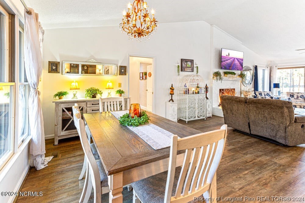 Undisclosed Address West End, NC 27376 - Photo 12 of 49 a living room with furniture and a chandelier