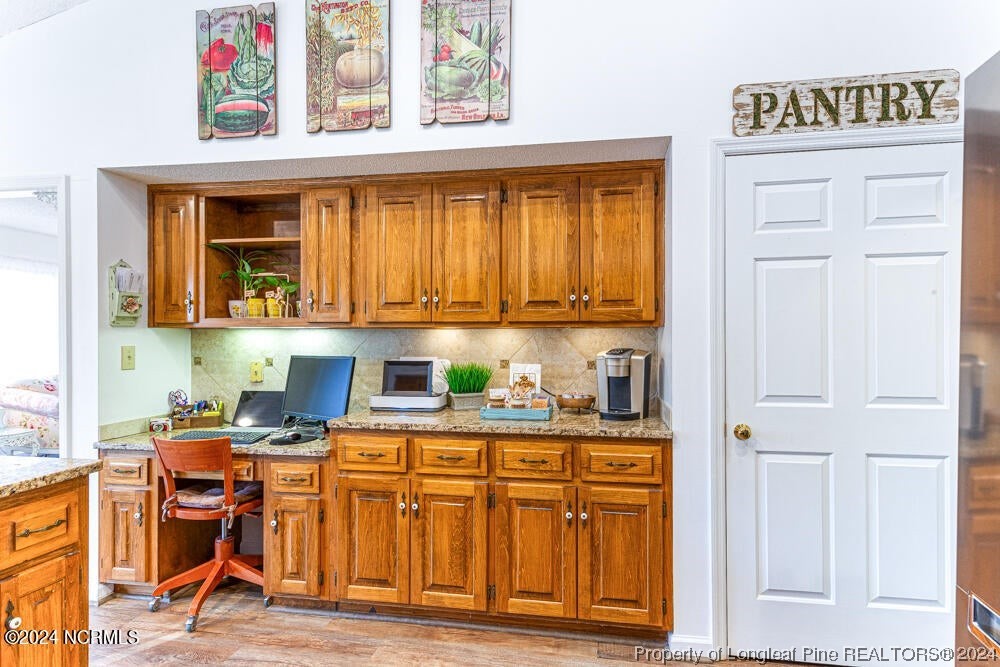 Undisclosed Address West End, NC 27376 - Photo 17 of 49 a kitchen with stainless steel appliances granite countertop a stove and cabinets
