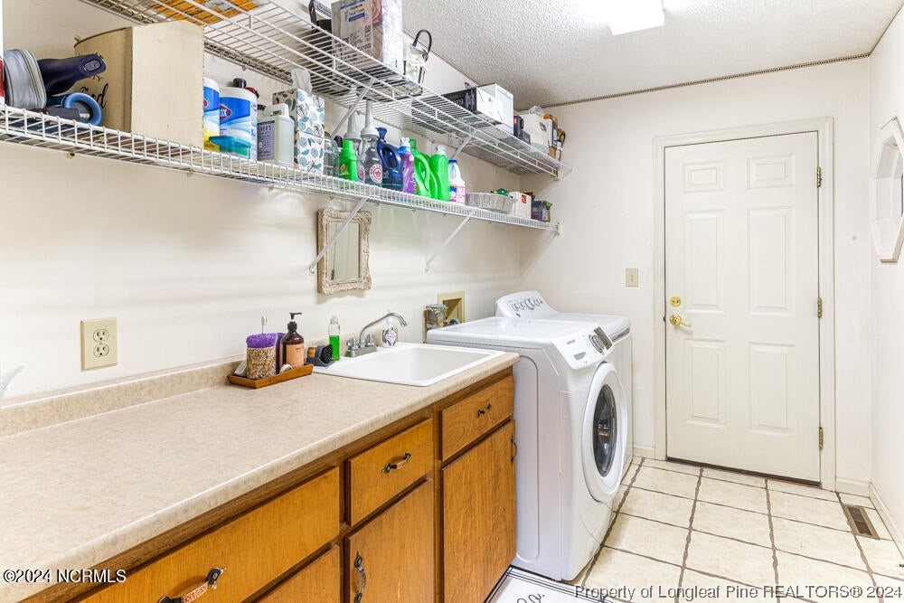 Undisclosed Address West End, NC 27376 - Photo 27 of 49 a utility room with dryer and washer