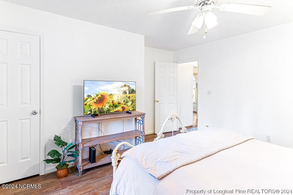 Undisclosed Address West End, NC 27376 - Photo 29 of 49 a bedroom with a bed and a flat screen tv