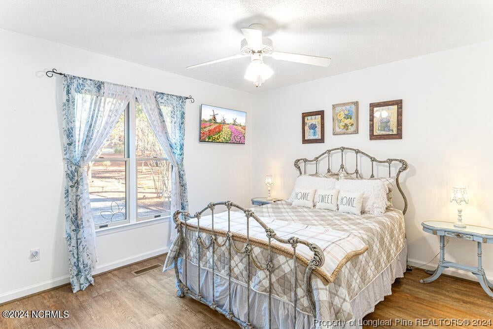 Undisclosed Address West End, NC 27376 - Photo 31 of 49 a bedroom with a bed and a window