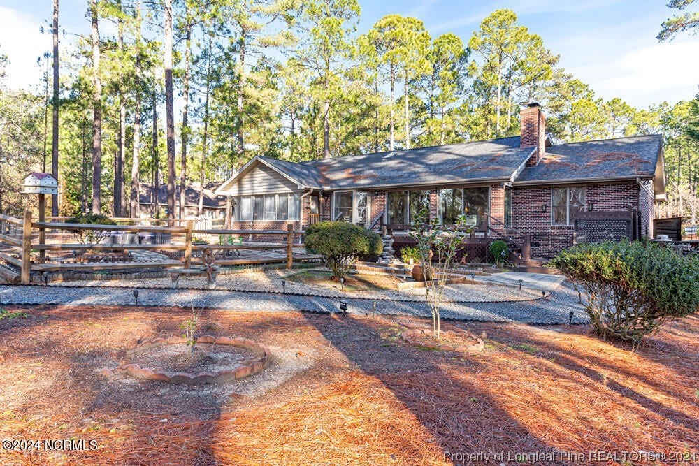 Undisclosed Address West End, NC 27376 - Photo 33 of 49 a house view with a sitting space and garden view
