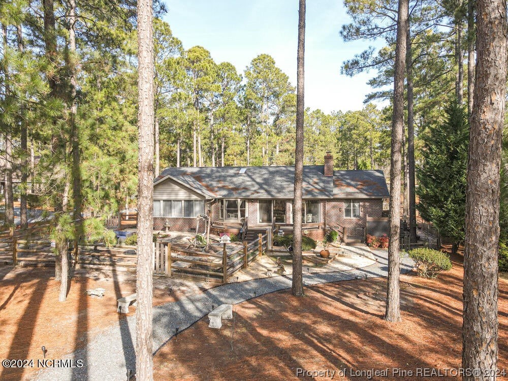 Undisclosed Address West End, NC 27376 - Photo 34 of 49 a view of a large building with a tree
