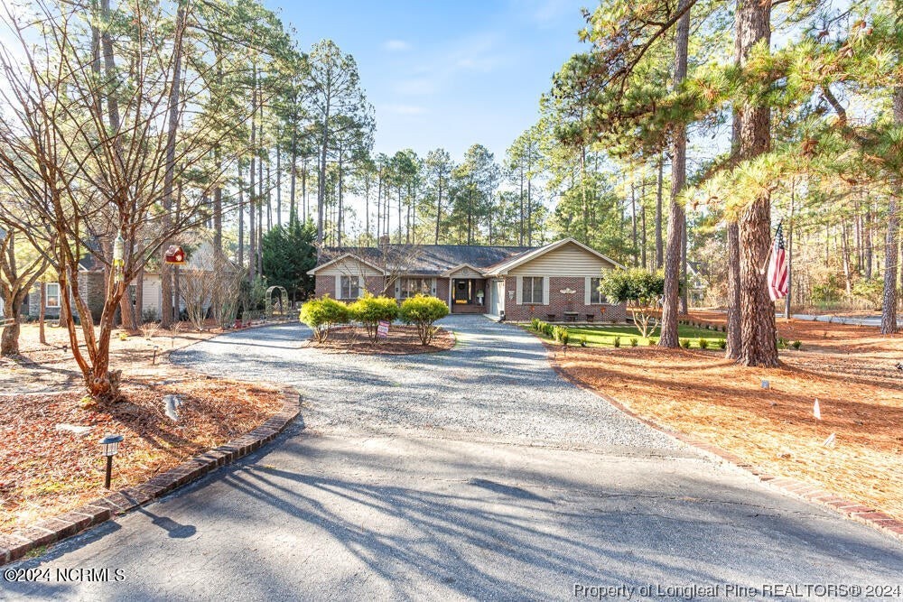 Undisclosed Address West End, NC 27376 - Photo 4 of 49 a house with trees in the background