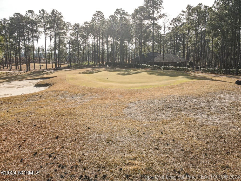 Undisclosed Address West End, NC 27376 - Photo 43 of 49 a view of a swimming pool with an outdoor space and seating area