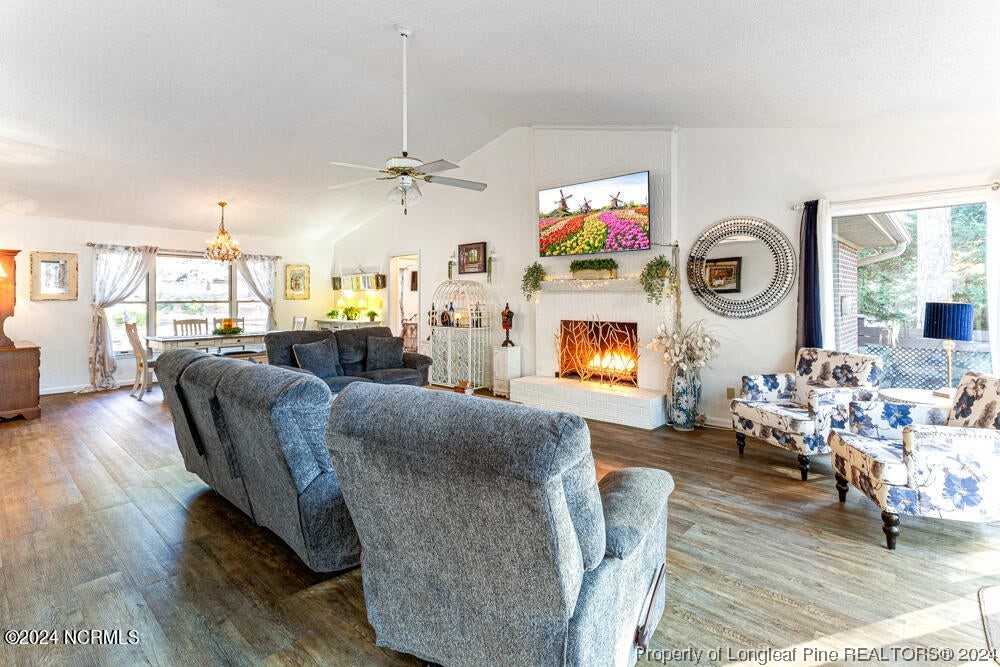 Undisclosed Address West End, NC 27376 - Photo 7 of 49 a living room with fireplace furniture and a flat screen tv