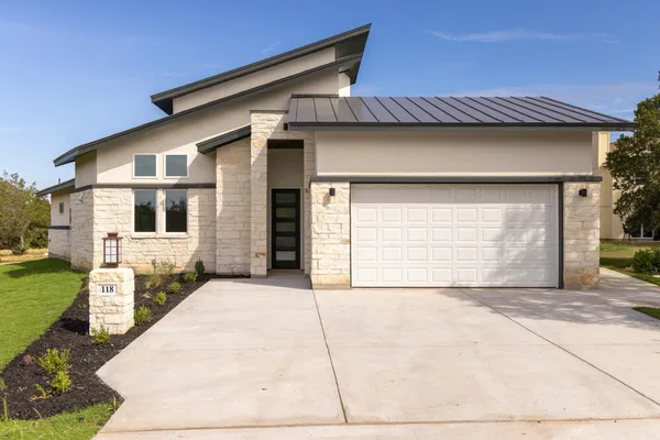 a front view of a house with a garage