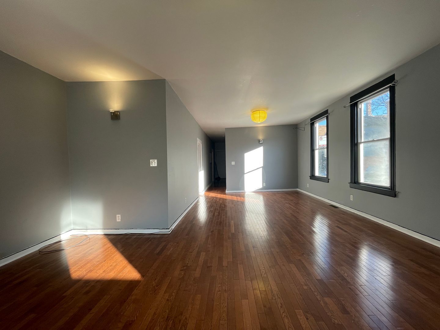 1819 South May Street, Unit 1 Chicago, IL 60608 - Photo 2 of 7 a view of empty room with wooden floor and fan