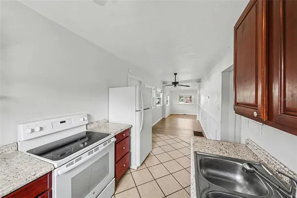 a kitchen with a stove and a refrigerator