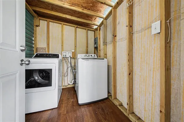 a view of a kitchen with washer and dryer