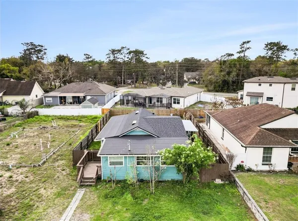 an aerial view of a house with a garden