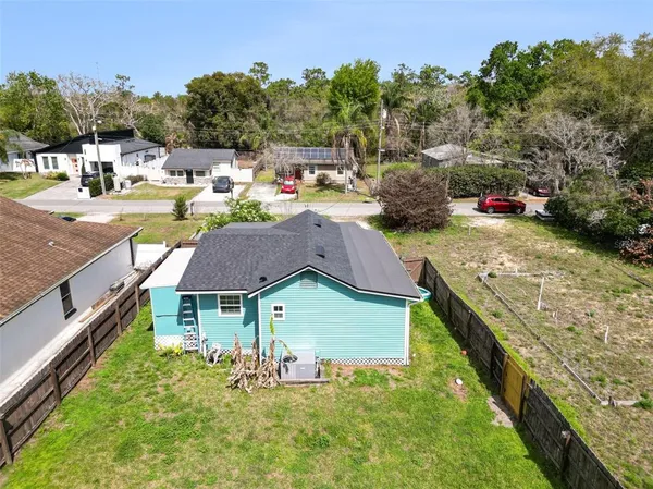 a aerial view of a house with swimming pool and sitting area