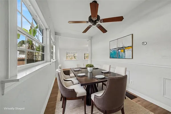 a dining room with furniture and window