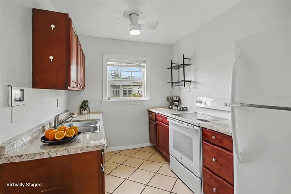 a kitchen with a sink appliances and cabinets