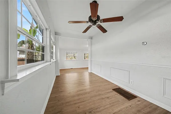 a view of an entryway with wooden floor