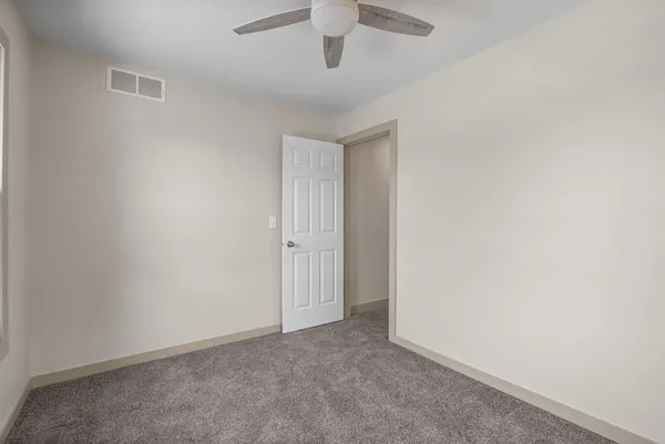 a view of an empty room and window