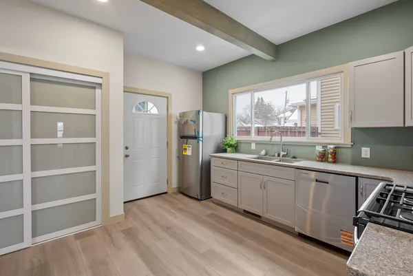 a kitchen with sink cabinets and window