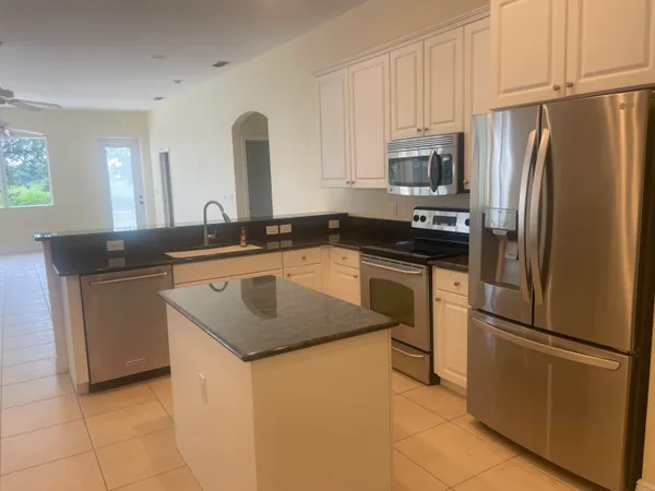 a kitchen with a cabinets and a stove top oven