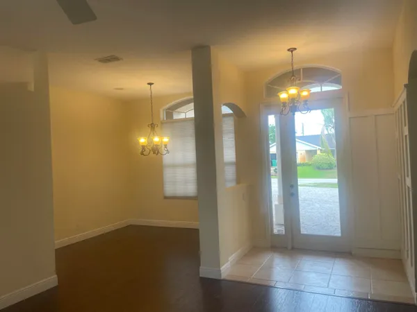a kitchen with stainless steel appliances a refrigerator and wooden cabinets