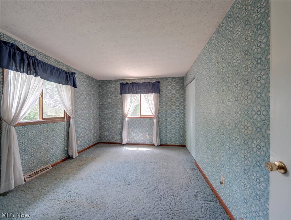 11430 Ferry Road Chesterland, OH 44026 - Photo 18 of 38 Carpeted empty room featuring a textured ceiling