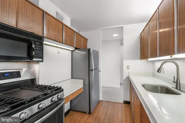 a kitchen with a sink and cabinets