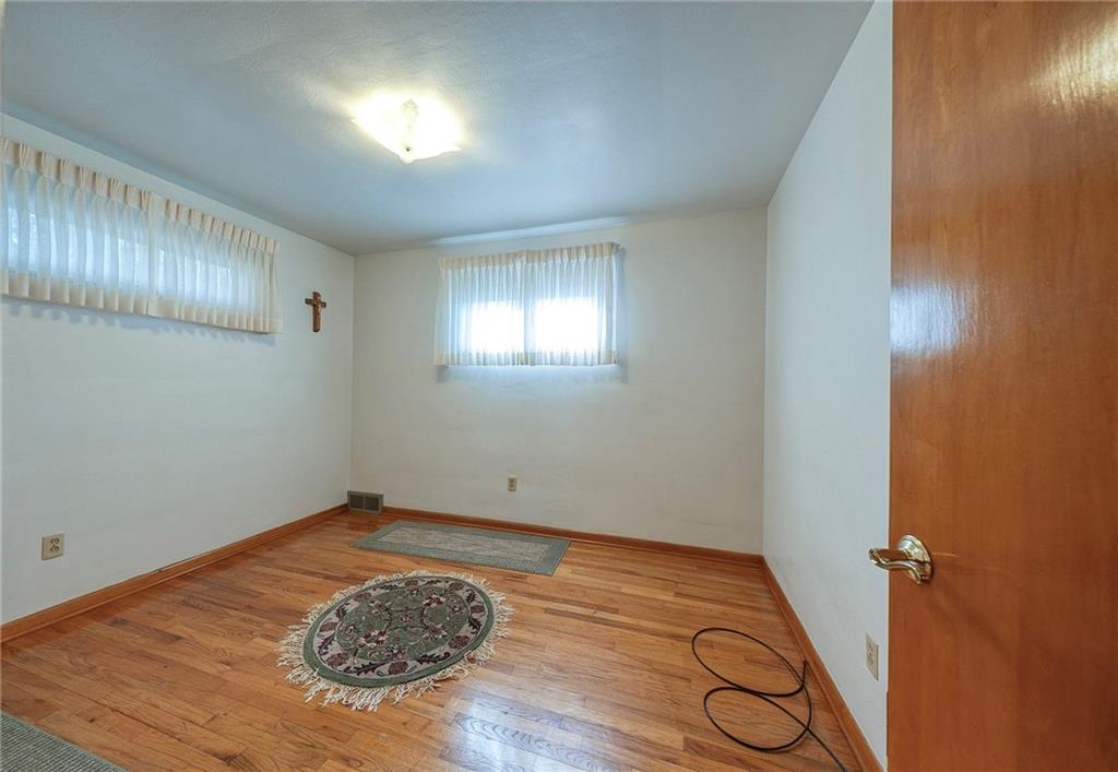 36 Roxbury Road Pittsburgh, PA 15221 - Photo 11 of 24 Second Bedroom has gleaming hardwood floors and lots of natural light.