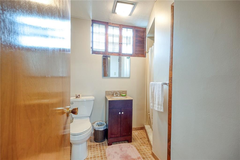 36 Roxbury Road Pittsburgh, PA 15221 - Photo 17 of 24 This second bathroom, located in the lower level, is designed for practicality and convenience.