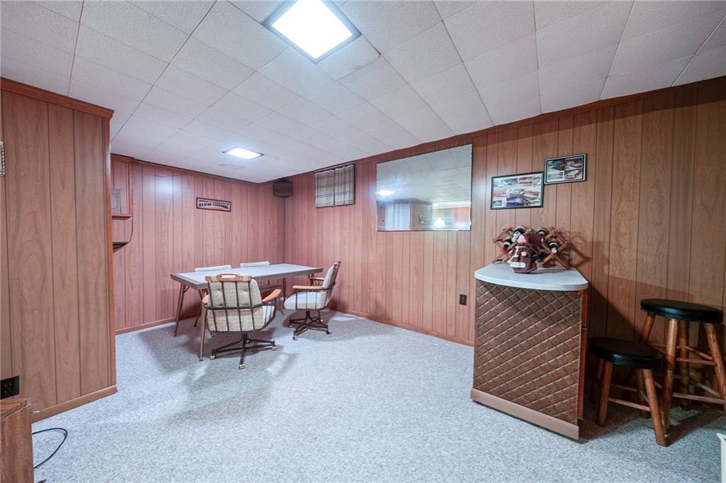 36 Roxbury Road Pittsburgh, PA 15221 - Photo 20 of 24 This space in the family rooms is perfect for family night board games. The small bar offers a convenient spot for serving drinks and snacks.