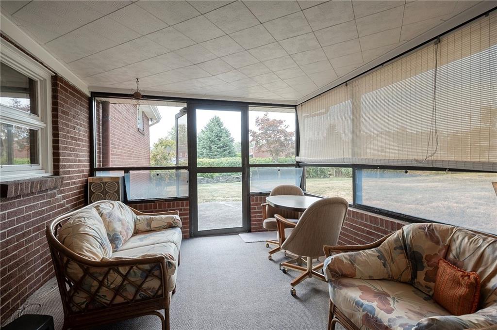 36 Roxbury Road Pittsburgh, PA 15221 - Photo 7 of 24 Enjoy a morning coffee in the sun room filled with an abundance of natural light.