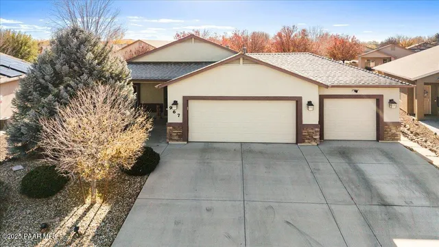 a view of a house with a yard and garage