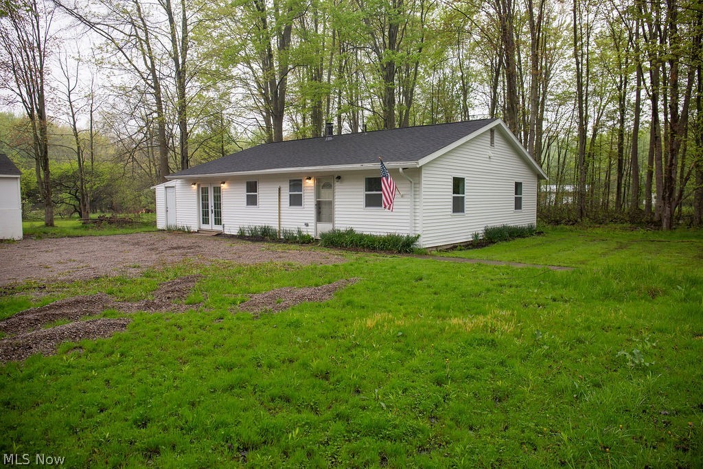 3644 Padanarum Road Geneva, OH 44041 - Photo 19 of 19 White siding exterior with a black shingle roof