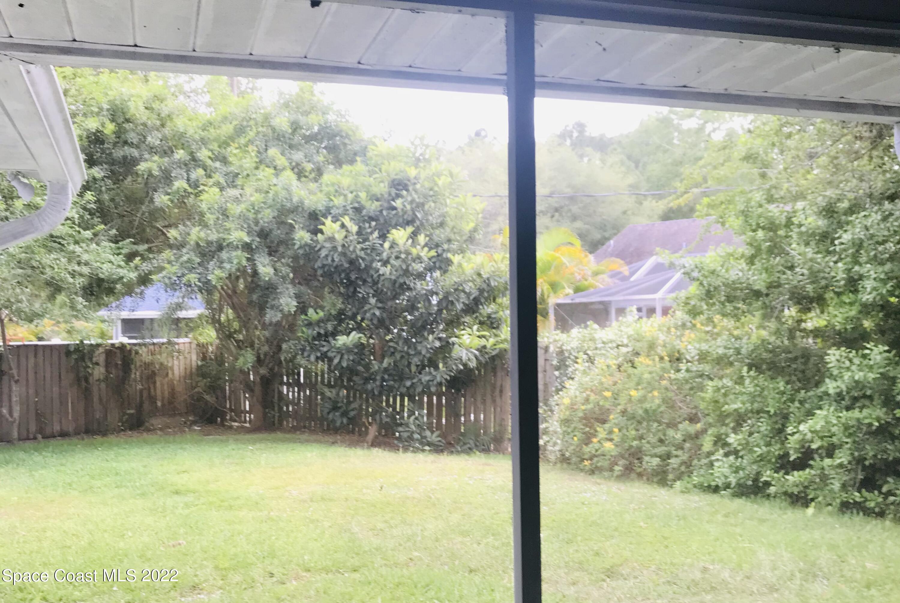 200 Rios Circle Southeast Palm Bay, FL 32909 - Photo 15 of 18 Back yard off of pation South