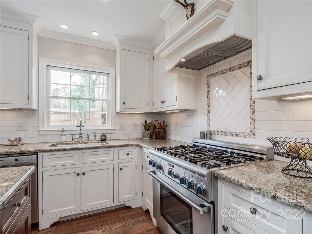 416 Whitestone Road Charlotte, NC 28270 - Photo 12 of 28 a kitchen with a stove sink and cabinets