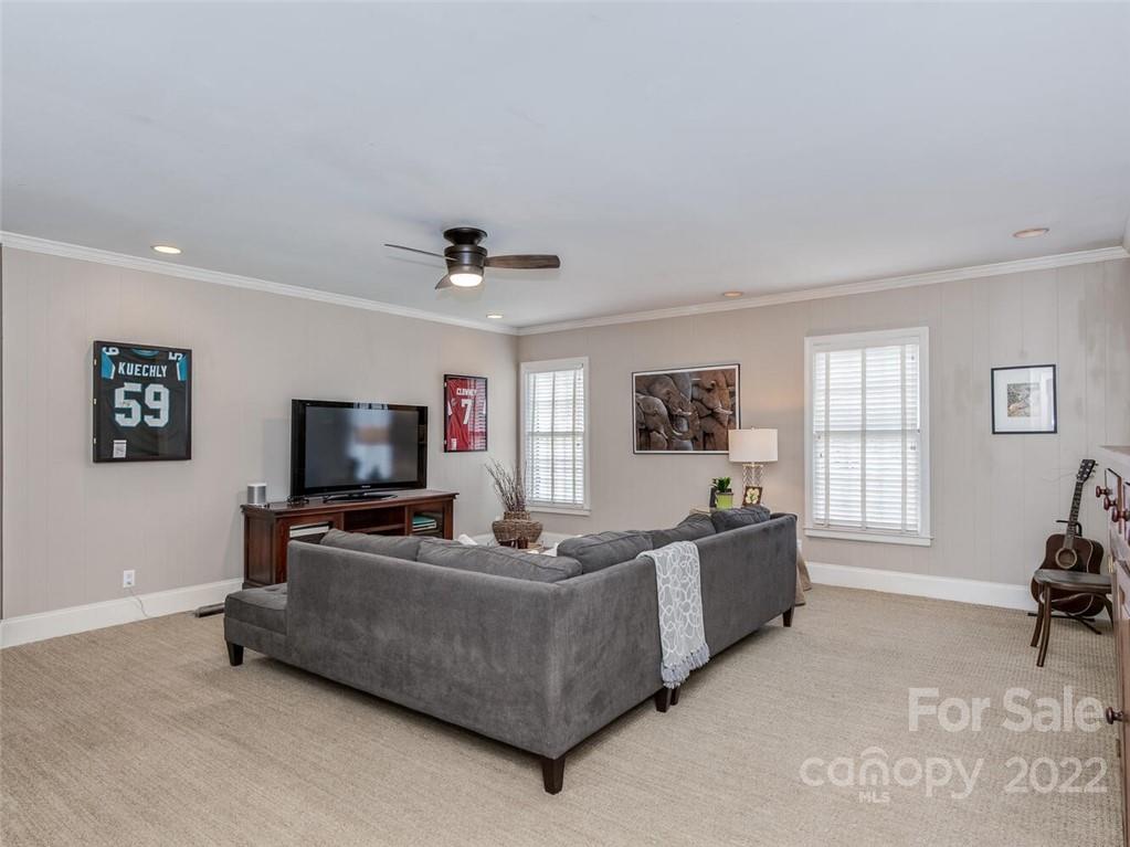 416 Whitestone Road Charlotte, NC 28270 - Photo 16 of 28 a living room with furniture and a flat screen tv