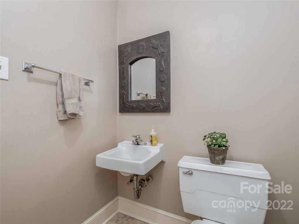416 Whitestone Road Charlotte, NC 28270 - Photo 17 of 28 a bathroom with a sink a mirror and a potted plant