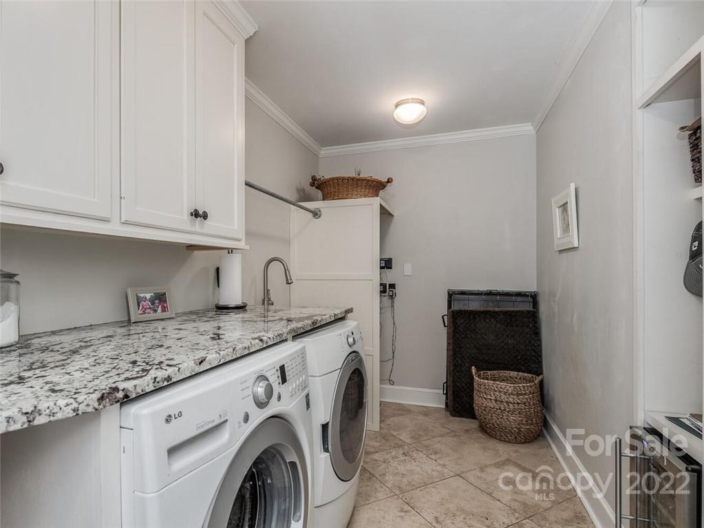 416 Whitestone Road Charlotte, NC 28270 - Photo 18 of 28 a utility room with sink dryer and washer