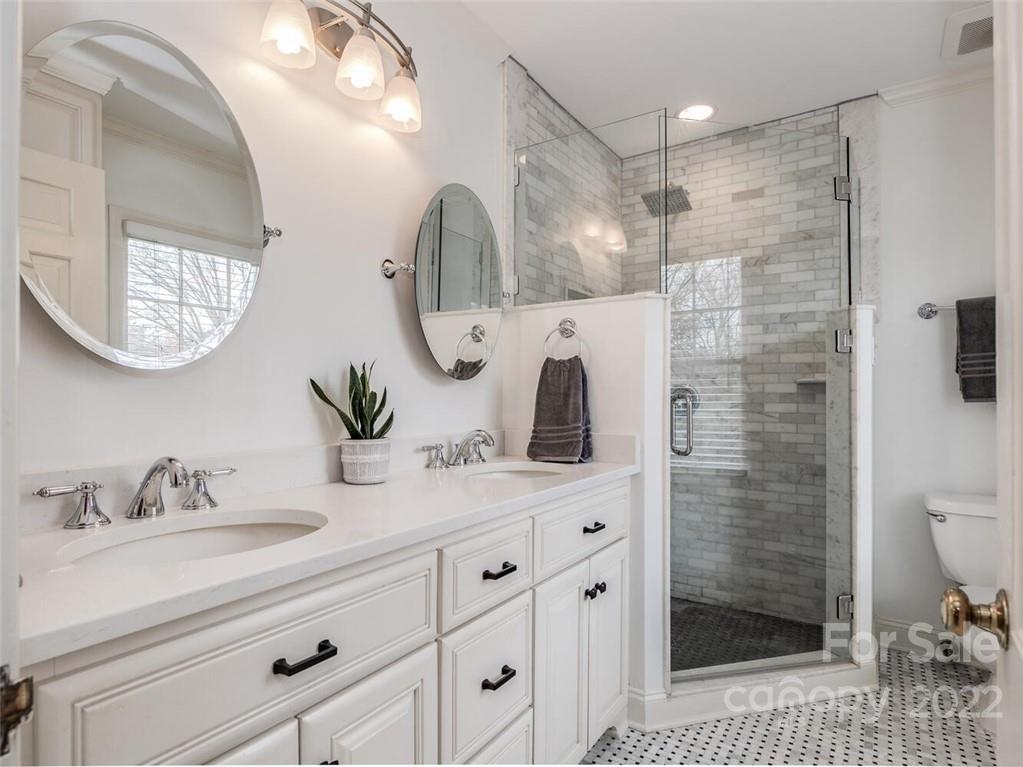 416 Whitestone Road Charlotte, NC 28270 - Photo 20 of 28 a bathroom with a sink a toilet and shower