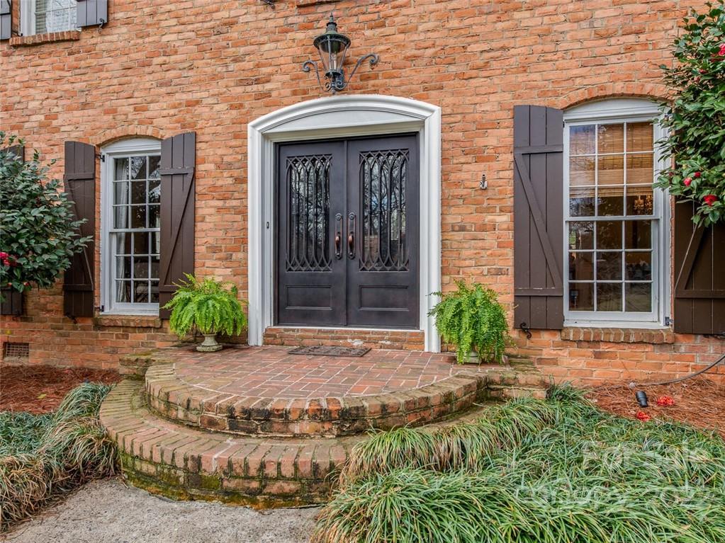 416 Whitestone Road Charlotte, NC 28270 - Photo 2 of 28 front view of a brick house with a yard