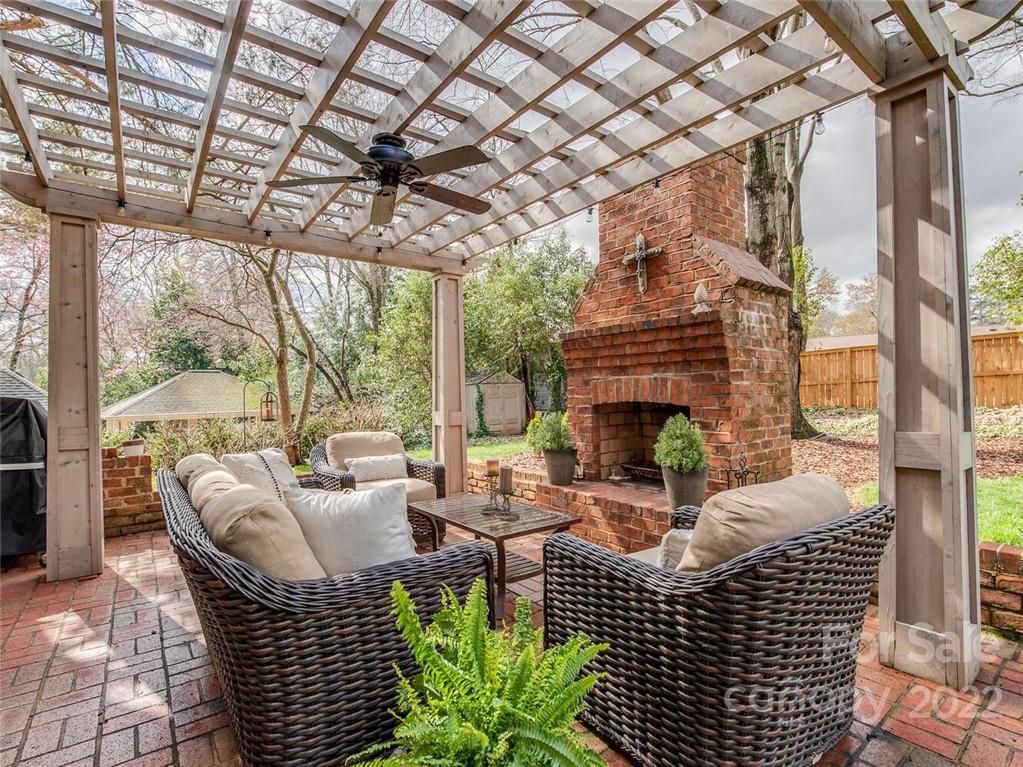416 Whitestone Road Charlotte, NC 28270 - Photo 25 of 28 a living room with furniture a fireplace and a table