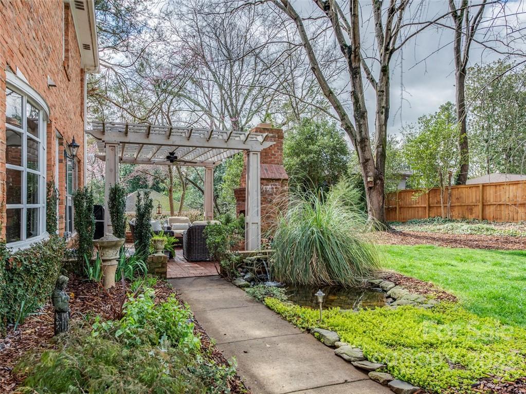 416 Whitestone Road Charlotte, NC 28270 - Photo 26 of 28 a view of a garden with brick walls