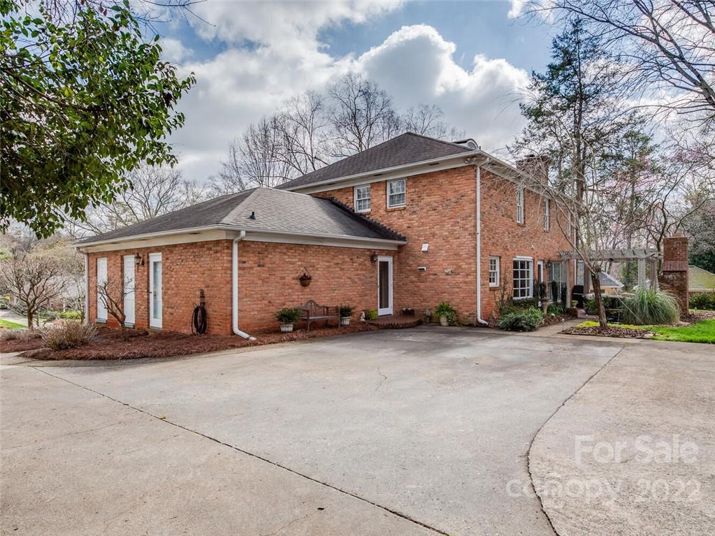 416 Whitestone Road Charlotte, NC 28270 - Photo 27 of 28 a view of a house with a patio and a yard