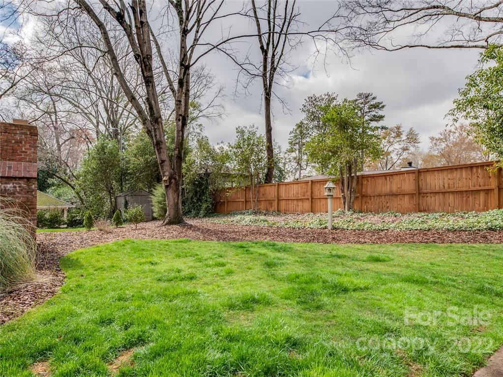 416 Whitestone Road Charlotte, NC 28270 - Photo 28 of 28 a view of a backyard with large trees