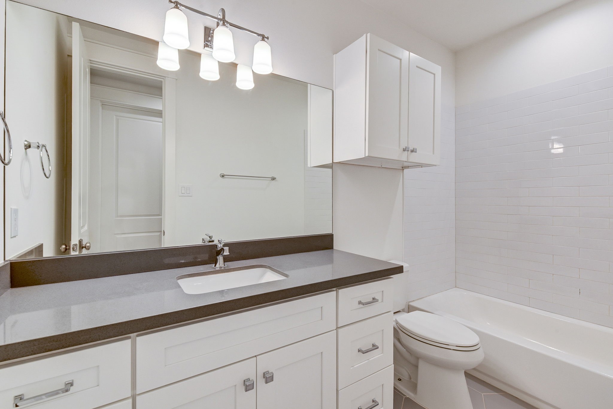 2575 Judiway Street Houston, TX 77018 - Photo 17 of 48 a bathroom with a sink a toilet and a mirror