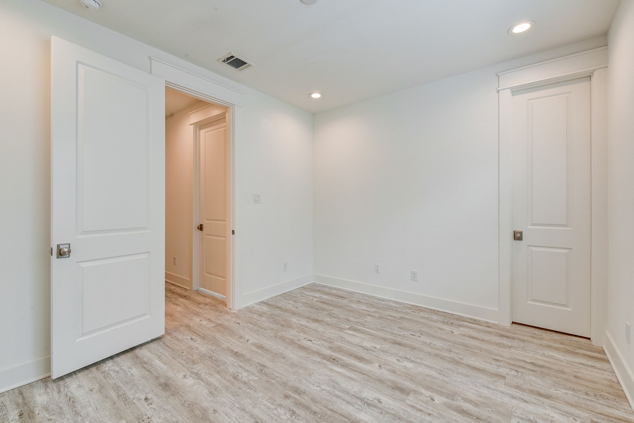 2575 Judiway Street Houston, TX 77018 - Photo 24 of 48 a view of an empty room with wooden floor