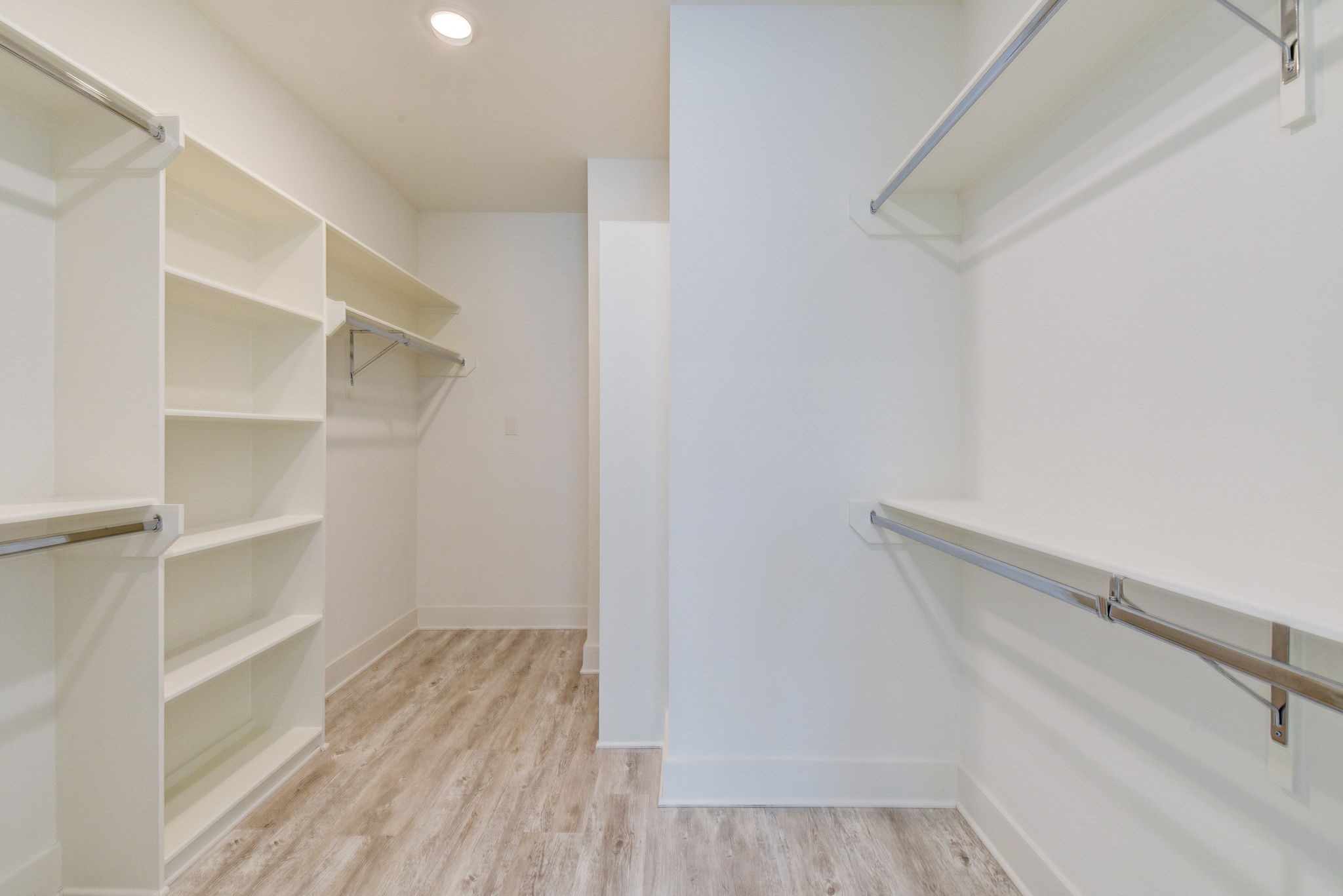 2575 Judiway Street Houston, TX 77018 - Photo 7 of 48 a view of walk in closet with empty racks