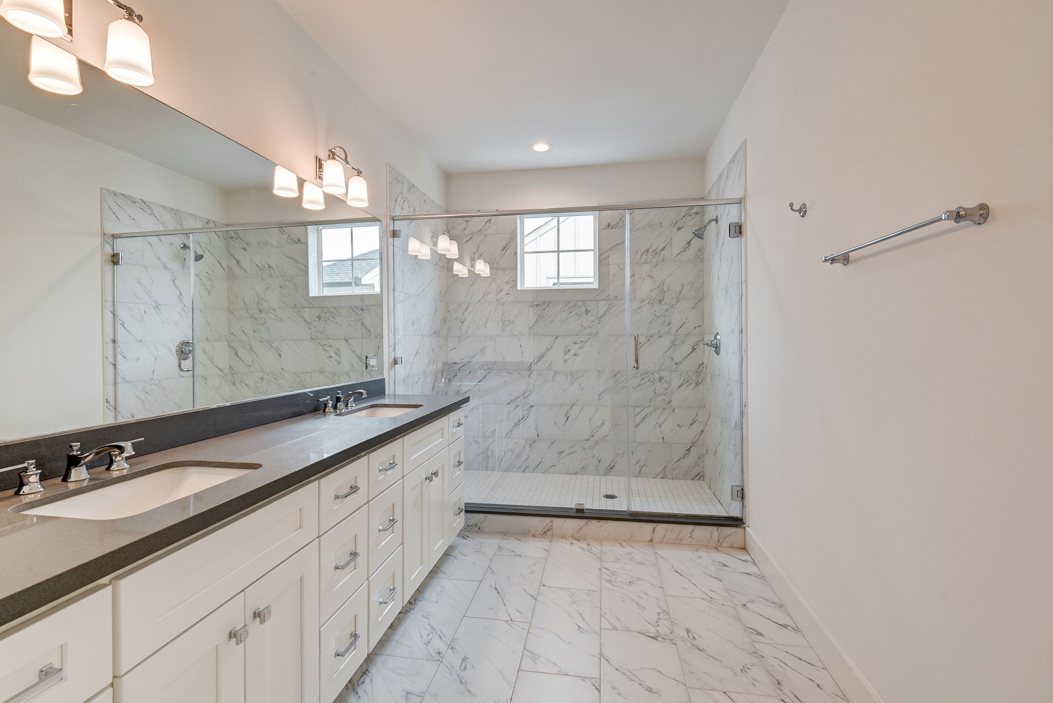 2575 Judiway Street Houston, TX 77018 - Photo 9 of 48 a spacious bathroom with a granite countertop sink mirror and shower